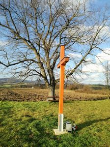 Kríž pri Kostolíku sťatia sv. Jána Krstiteľa Pominovec.